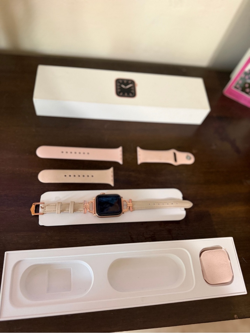 Apple Pink Smartwatch with Rose Gold-Tone Case and Multiple Pink Bands series 5